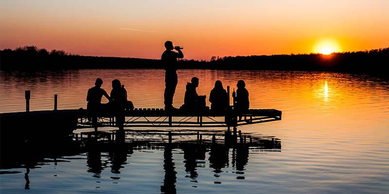 People on dock at lake